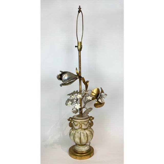 This large lamp features three-dimensional over-scale flowers in gleaming metallic tones of silver and gold. Smaller white...