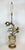 This large lamp features three-dimensional over-scale flowers in gleaming metallic tones of silver and gold. Smaller white...