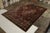 Hand knotted in wool originating from Nepal circa 1910-1920, this 9x12 antique rug connotes a Shahrestan rug design of...