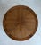 Elegant vintage round drum-form side table featuring a warm brown wood finish and a beautifully patterned veneer top with...