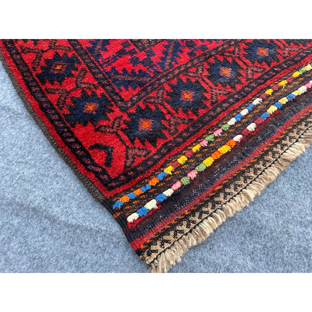 This Afghan Hand knotted Baluch Zanjiri rug with its Geometric pattern is a beautiful addition to any home. The Baluch rug...