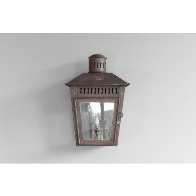 Wall mounted glazed brass GNR lantern. Circa 1950. Up to 250V (Europe/UK Standard).The wiring of this item may be original...