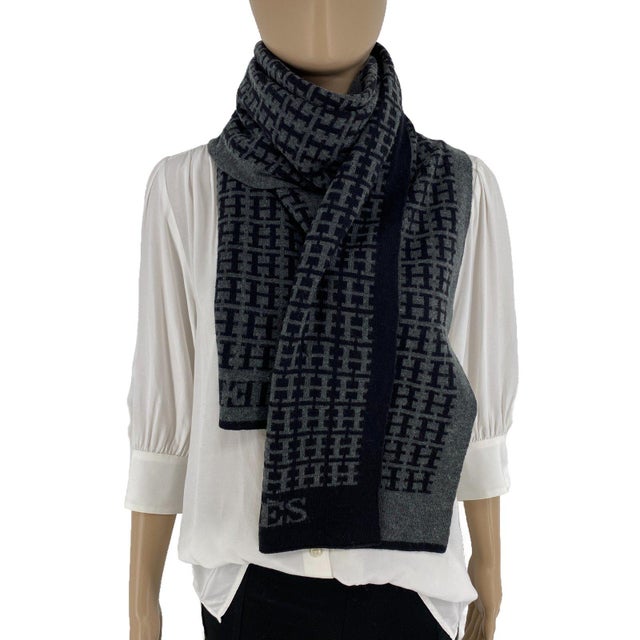 HERMES Vintage 100% Soft Woolmark Wool Scarf. Black and grey H-monogram knit, reversible, with HERMES lettering at both...