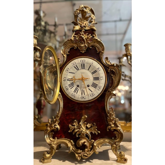 TIFFANY SIGNED 3 PIECE clock/candelabra set. This is a late 19th-century French clock in the Boulle marquetry style....