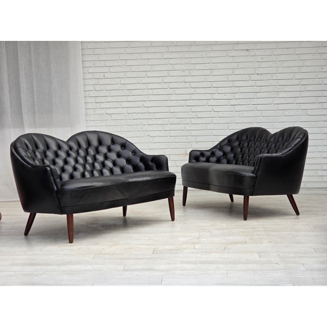 1960s, Scandinavian sofa in black furniture leather. Beech wood legs, springs in the seat. Original good condition: no...