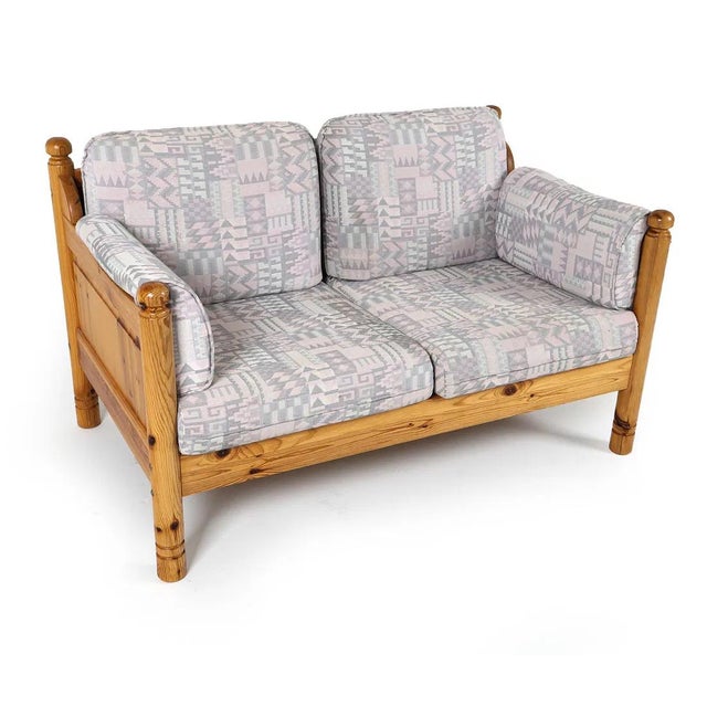 Matching pair of pine frame sofas with patterned vintage fabric cushions. The sofas are from Sweden, circa 1970s/80's....
