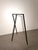 Sleek and architectural freestanding clothes rack crafted from black metal. The minimalist open-frame construction...