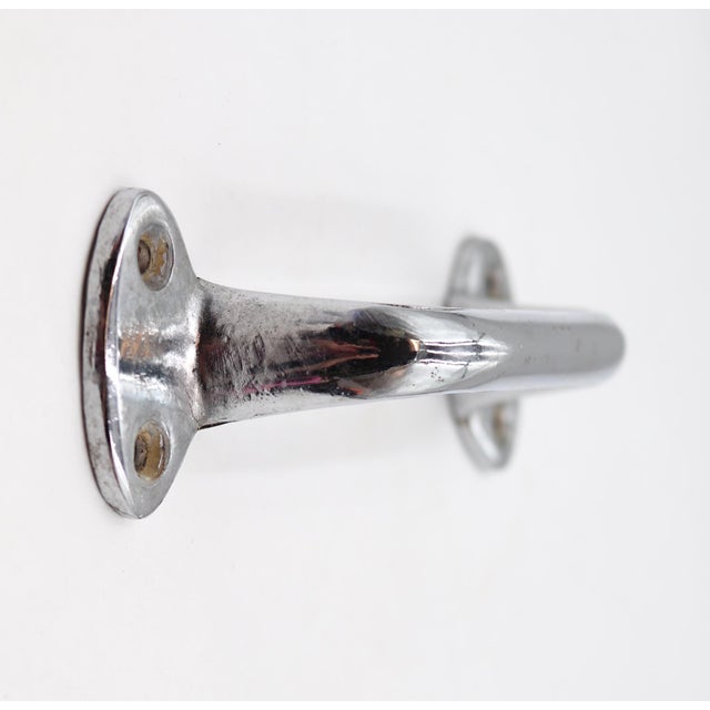 Vintage cabinet or drawer pull made of brass with a chrome finish. Stamped L.S. Brown Co. The original mounting screws are...