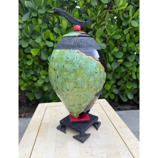 Striking vintage studio ceramic covered urn featuring an organic ovoid form, dramatic textured black surfaces, mottled...