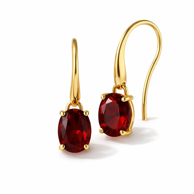 These elegant drop earrings feature the rich and captivating beauty of garnet gemstones, celebrated for their deep red hue...