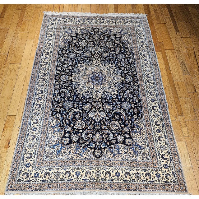"This finely hand knotted Persian Nain rug, crafted in the 3rd quarter of the 1900s, is a true masterpiece of traditional...