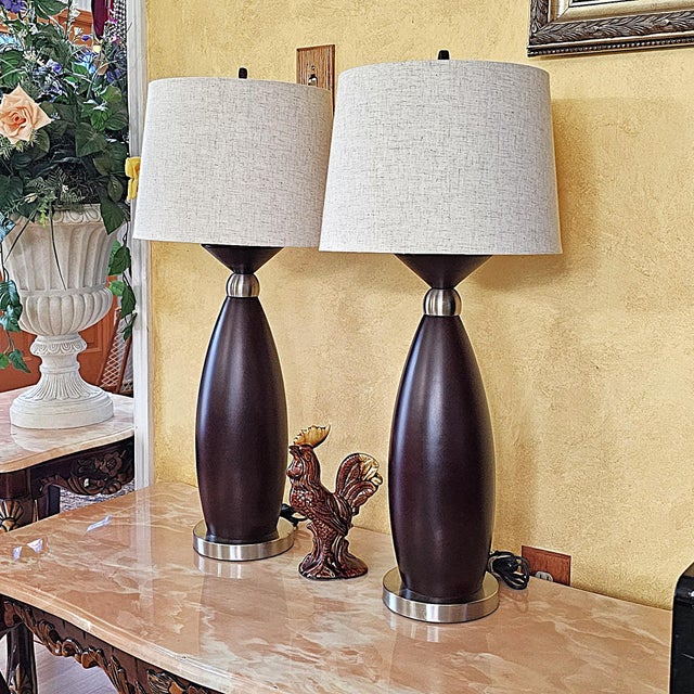 Pair of Contemporary Espresso Wood Hourglass Lamps With Brushed Nickel Accents and Linen Shades For Sale - Image 14 of 18