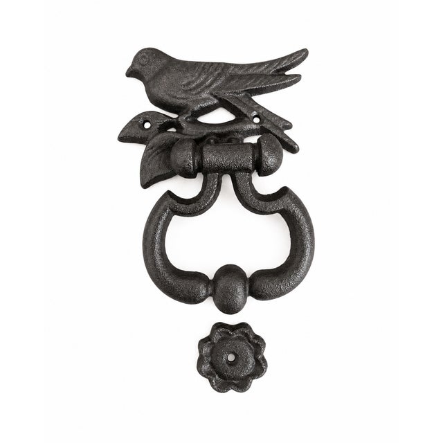 A charming wrought iron bird door knocker from France, featuring a sculptural bird perched on a branch above a substantial...