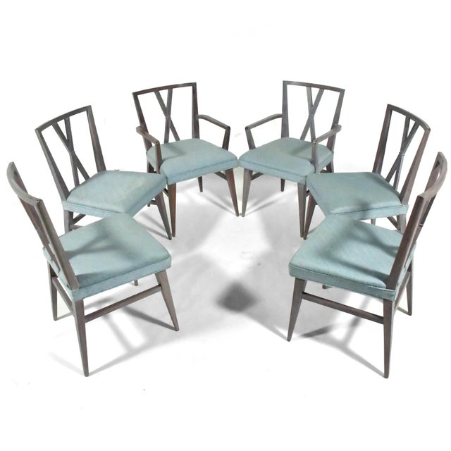 This set of six sophisticated dining chairs designed by Tommi Parzinger for Charak are terrific examples of his refined...