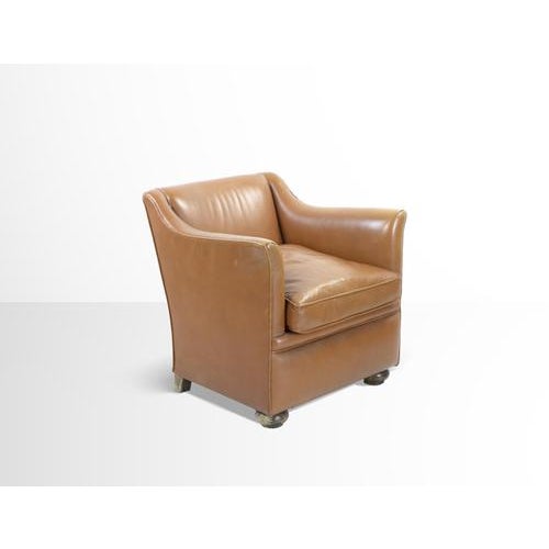 Vintage Leather Armchair is a design furniture item realized in Italy in the mid-20th Century. A beautiful light brown...