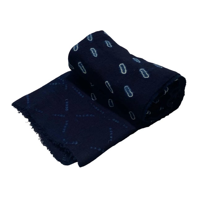 This fabric is woven by the skilled hands of the Mossi people in Burkina Faso. It is a rare and unique traditional...