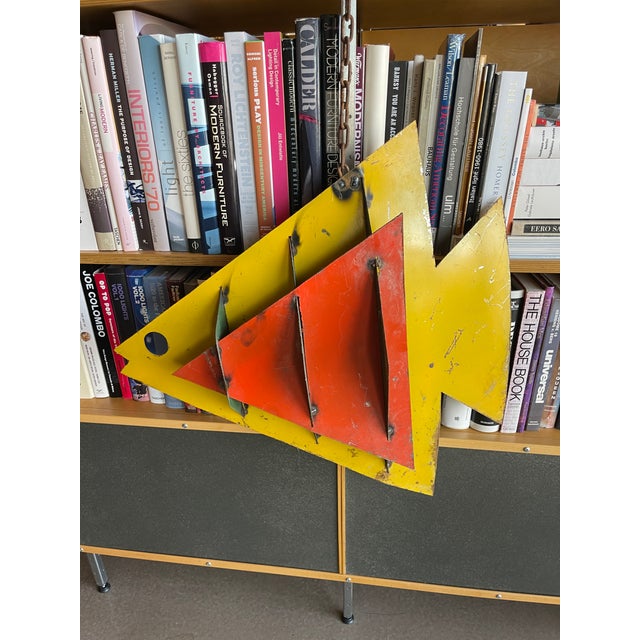 Incredible Calder style steel cut metal suspended fish sculpture. Pop art green, red and yellow color palette with large...