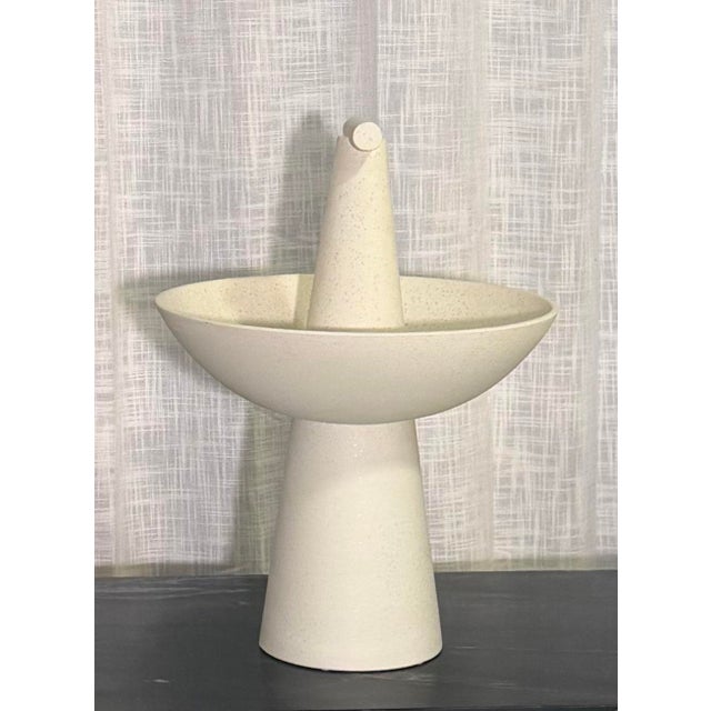 Sculptural Champion Bowl in Ivory by Studio A (Global Views), featuring a striking architectural silhouette with a wide,...