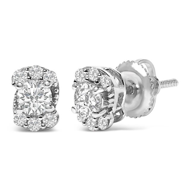 Unveil the quintessence of elegance with these exquisite stud earrings, meticulously crafted from radiant .925 sterling...