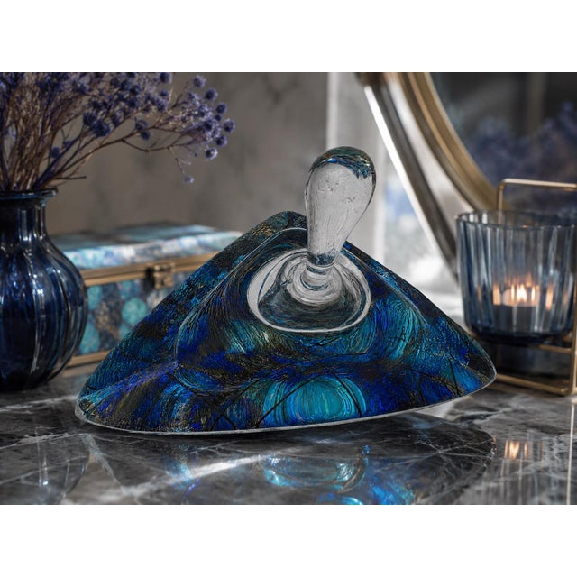 A striking signed Murano art glass perfume bottle featuring a sculptural triangular form with brilliant blue, violet,...