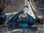 A striking signed Murano art glass perfume bottle featuring a sculptural triangular form with brilliant blue, violet,...