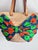 Textile A Giselle Handwoven Straw Basket / Tote Featuring a Large Bow Made From Colorful Print and Brown Leather Shoulder Straps. For Sale - Image 7 of 12