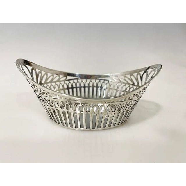 Dutch small silver bonbon basket by c. Hooikaas, 1923 small silver basket by c. Hooikaas a boat shaped basket openwork...