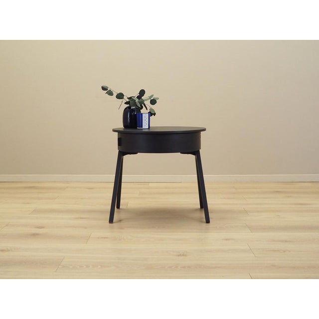 The sewing table was made in the 1970s, Danish production. The structure and legs are made of solid wood. The top is...