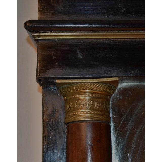 1810 French empire overmantle mirror . The flat surfaces are done in black lacquer, with brass moldings on either side of...