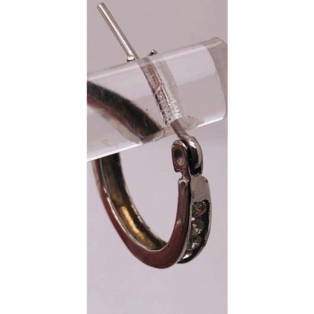 14 Karat White Gold Diamond Half Hoop Earrings 0.25 total diamond weight. 2 grams total weight.