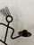 A playful vintage black metal candle holder with strong postmodern presence. Designed as an abstract stick figure in...