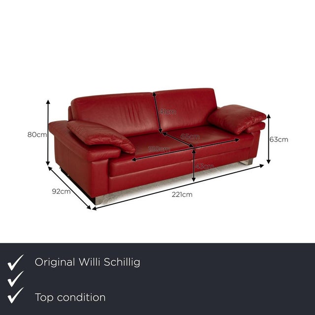 Willi Schillig's sofa is covered with a red real leather and stands on silver metal feet. The timeless design and the...