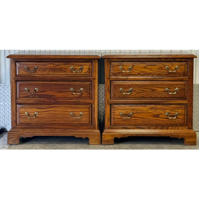 Chippendale style three drawer oak nightstand / commodes by Ethan Allen from their Canterbury Oak Collection. Nice raised...