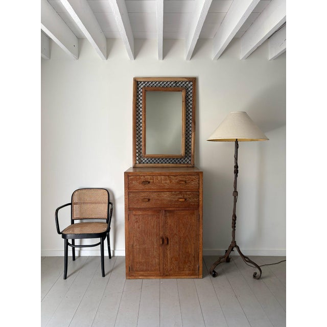 A large and impressive iron and wood wall mirror with a dual framing device. The solid wooden frames feature reeded...