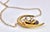 This is a beautiful Art Nouveau-style pendant necklace featuring a crescent moon motif crafted in gold with intricate...