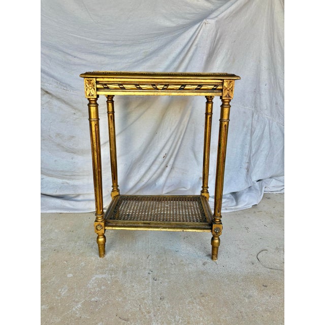 Found in the South of France, this Early 20th Century Louis XVI Style Gold Gilded and Marble Side Table was handcrafted by...