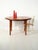 Scandinavian dining table from the 1960s in streaked teak, round and extendable, with three 40 cm extension leaves....