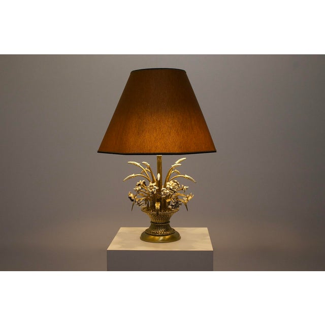 Table lamp depicting flowers and a sheaf of wheat, in brass and silver-plated metal, 1970s. Height with shade: 74 cm x...