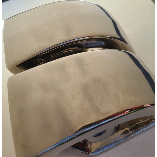 A true vintage pair of ceramic bookends attributed to Jaru. A bulbous quarter round shape with a sphere at the bottom,...