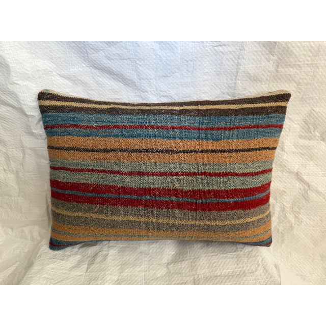 This authentic Antique 19th Century Turkish Kilim Pillow is handcrafted from a genuine handwoven wool kilim dating to the...
