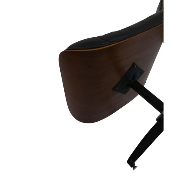 Walnut and Italian leather lounge chairs and ottomans, bent stacked laminated plywood swivel tilting walnut lounge chairs,...