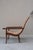 A generously proportioned lounge chair from circa 1870-1900, built around one long, flowing curve. The seat and back form...