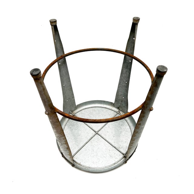 Add an industrial touch to any room with this metal stool from the 1950's era. It can be used as additional seating, as a...