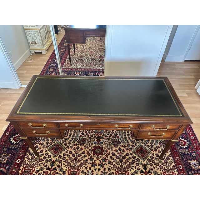 An exceptional example of John Widdicomb's renowned craftsmanship, this elegant mahogany partner's desk embodies the...