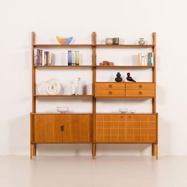 This fully renovated scandinavian teak free-standing wall unit was designed by fredrik a. Kayser and made by gustav bahus...