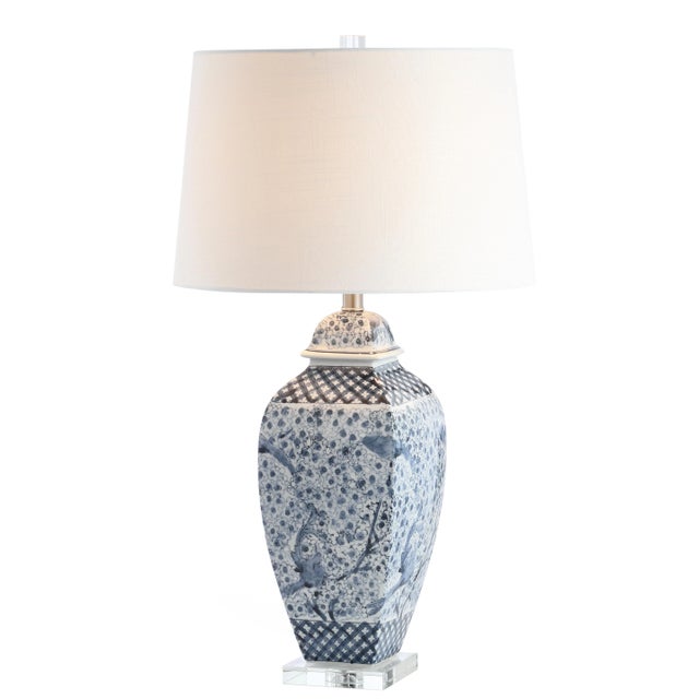 Inspired by the artistry on a priceless antique vase, this stunning blue and white table lamp is a timeless addition to...