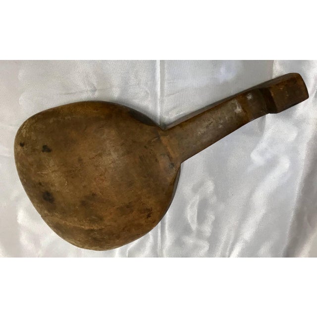 Featured is a primitive style spoon or paddle from France during the late 19th century. You can determine from the wear on...