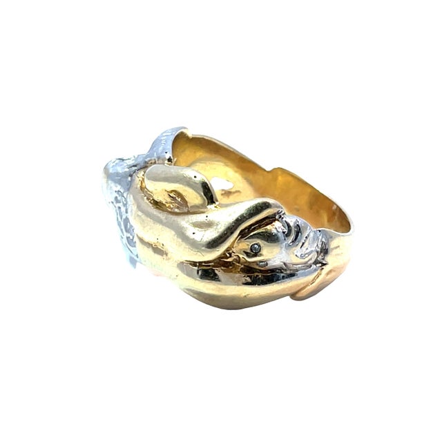 Make a bold artistic statement with this rare vintage figural ring, crafted in rich 14k yellow gold accented by white gold...