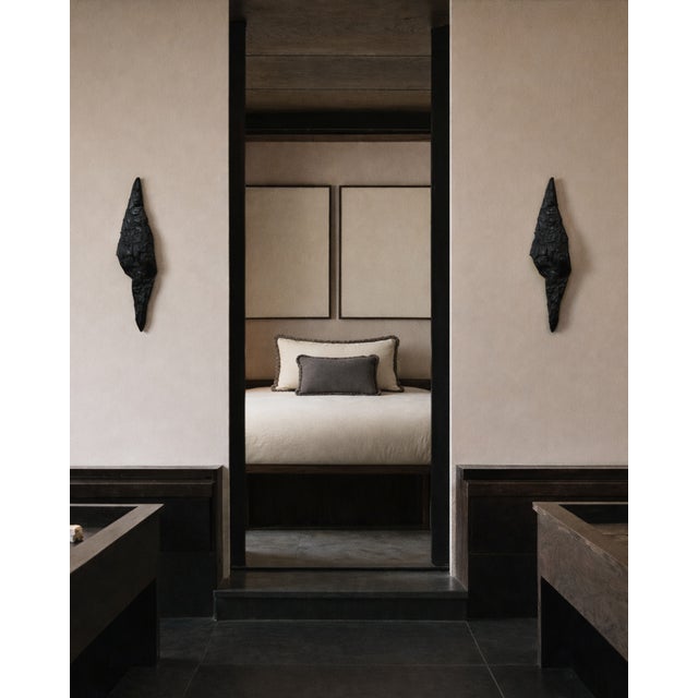 The contrasting chromatic scheme characterizing these couple of cushions lends it a distinct luxe yet restrained allure....