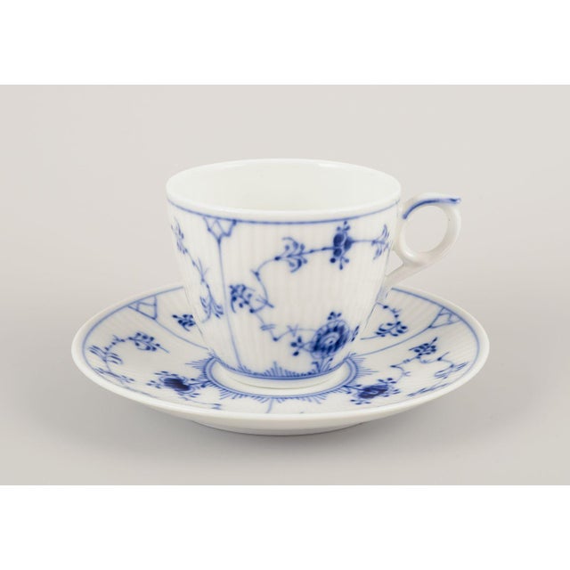 Royal copenhagen blue fluted plain. A set of four coffee cups with saucers. Model number 1/80-93 dated: 1969-1974. Marked....